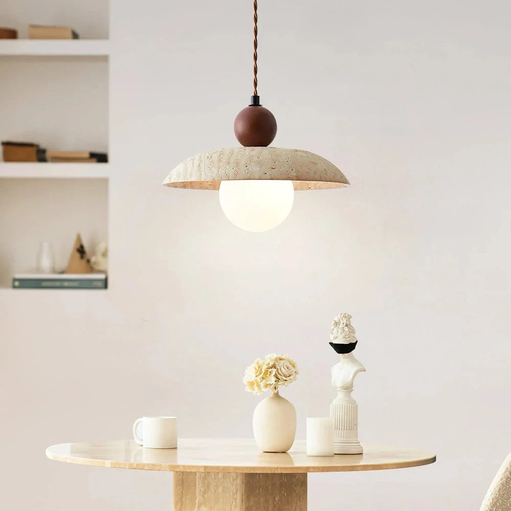 Travertine Disc Pendant Light Over Cream Dining Table