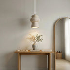 Sculptural Travertine Pendant Light Over Entryway Console Table