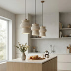Trio of Travertine Pendant Lights Over Kitchen Island