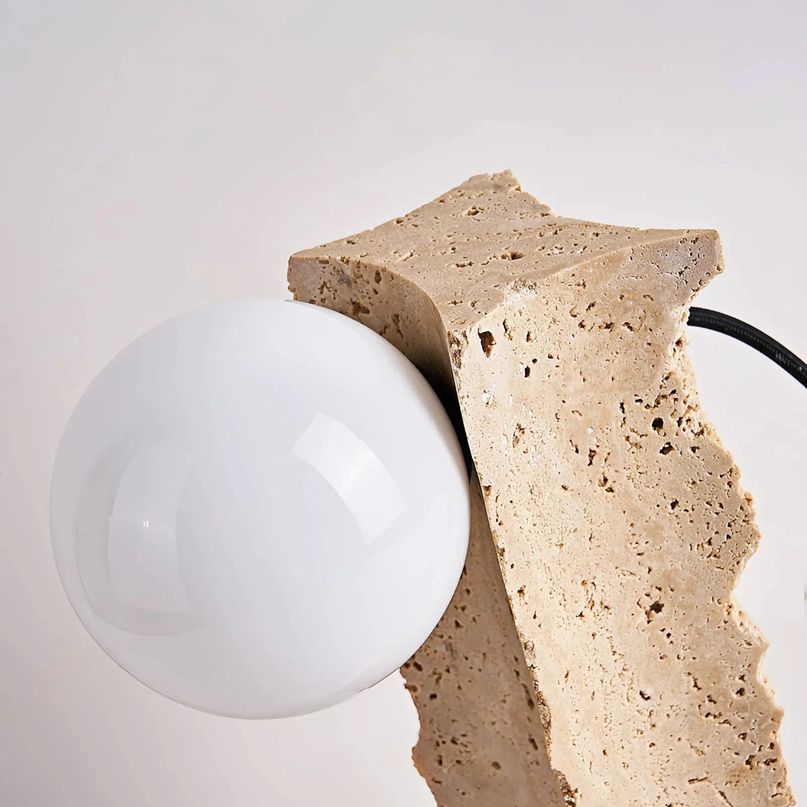 Top Down View of Chiseled Stone Pillar and Glass Globe