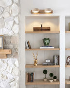 Modern Alabaster Wall Sconce Over Built-In Shelves in Stone Wall