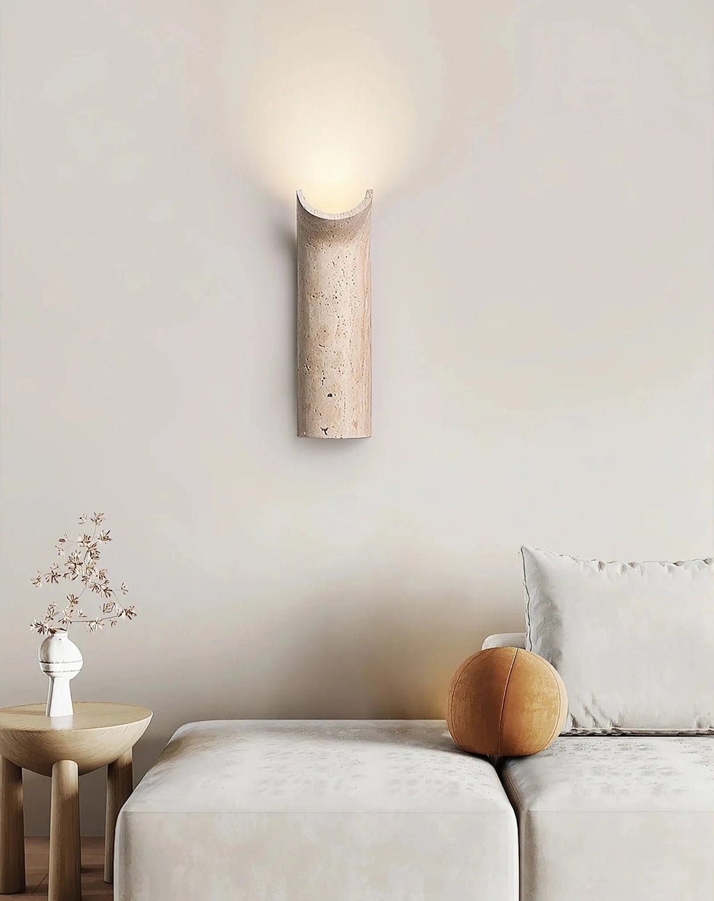 Wabi Sabi Travertine Wall Sconce Over Living Room Sofa
