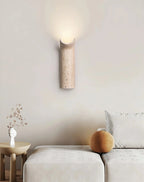 Wabi Sabi Travertine Wall Sconce Over Living Room Sofa