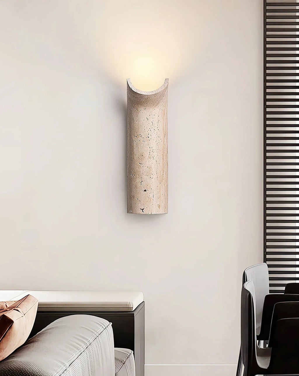 Wabi Sabi Travertine Sconce Illuminating Living Room Wall