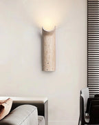 Wabi Sabi Travertine Sconce Illuminating Living Room Wall