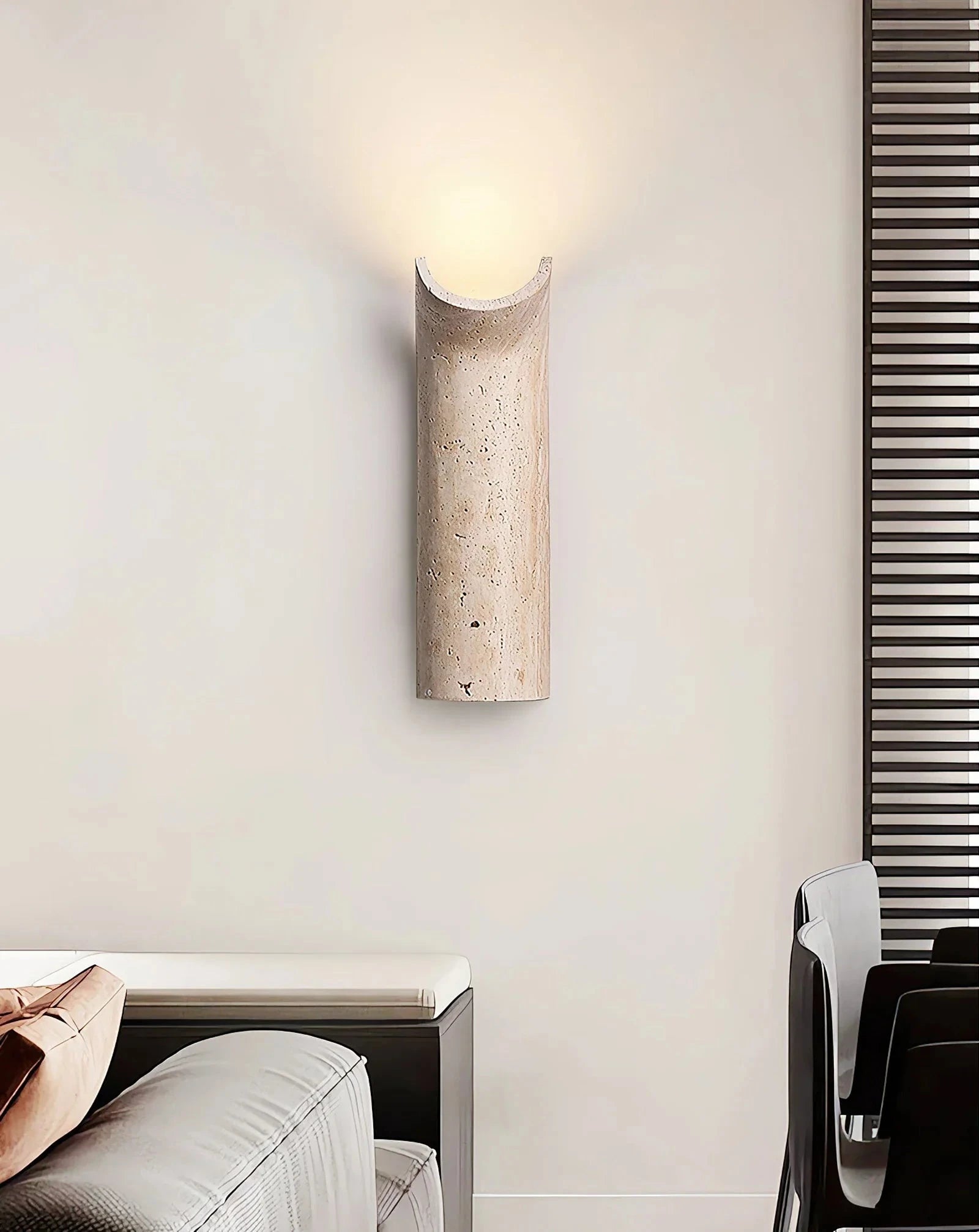 Wabi Sabi Travertine Sconce Illuminating Living Room Wall