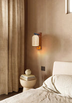 Japandi Travertine Wall Sconce Illuminating Bedroom Nook