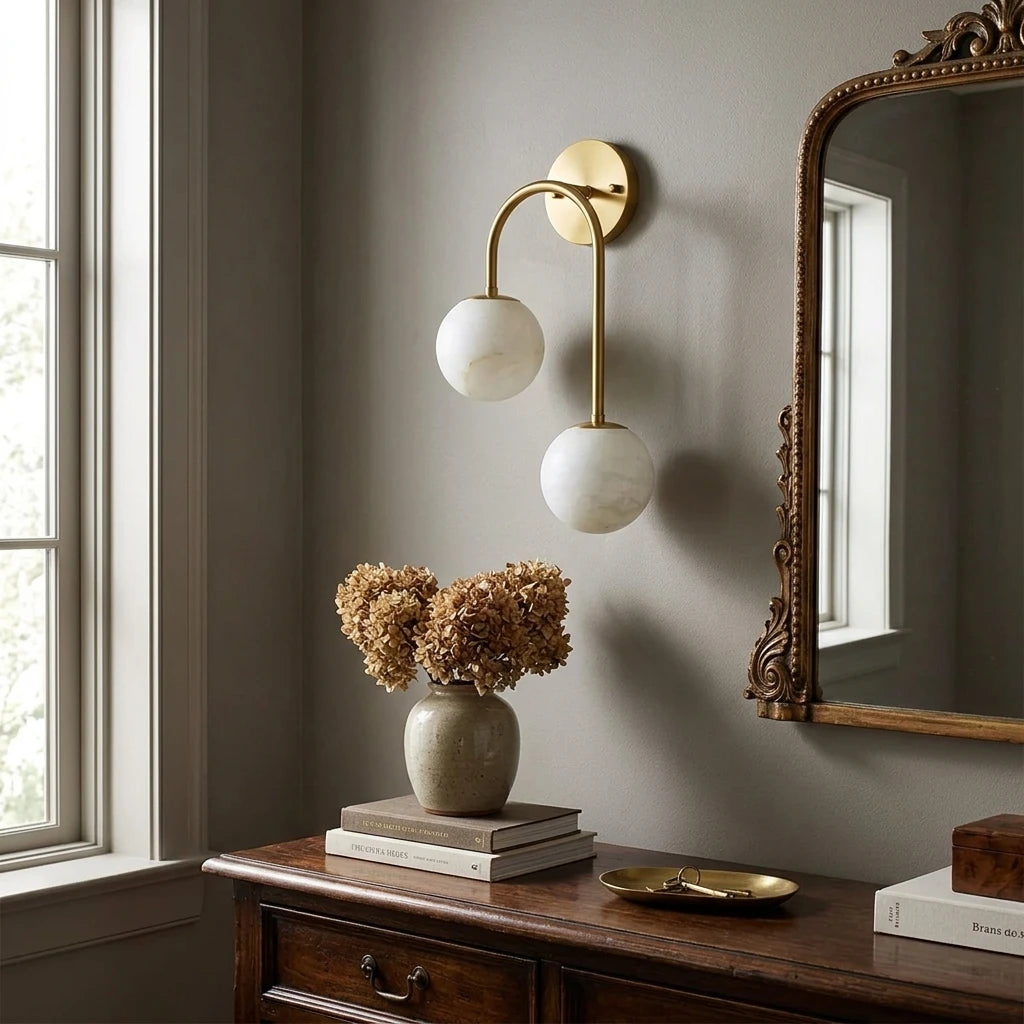 Modern Asymmetrical Globe Wall Sconce Over Console Table