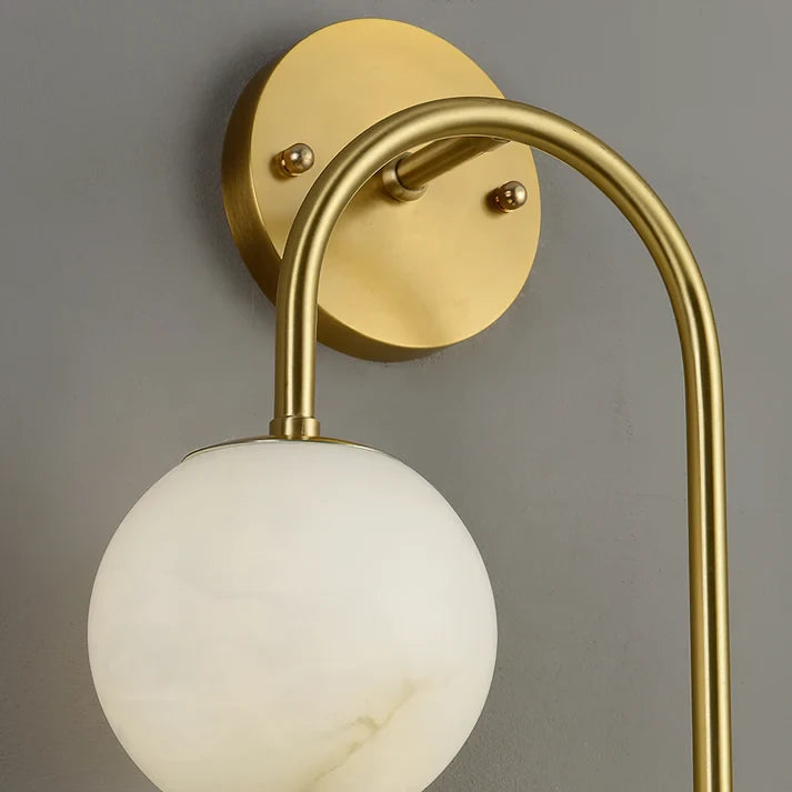 Close Up View of Brass Curved Arm and Alabaster Globe