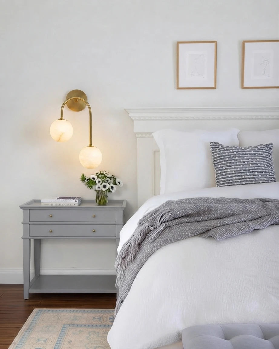 Modern Asymmetrical Globe Wall Sconce Over Nightstand