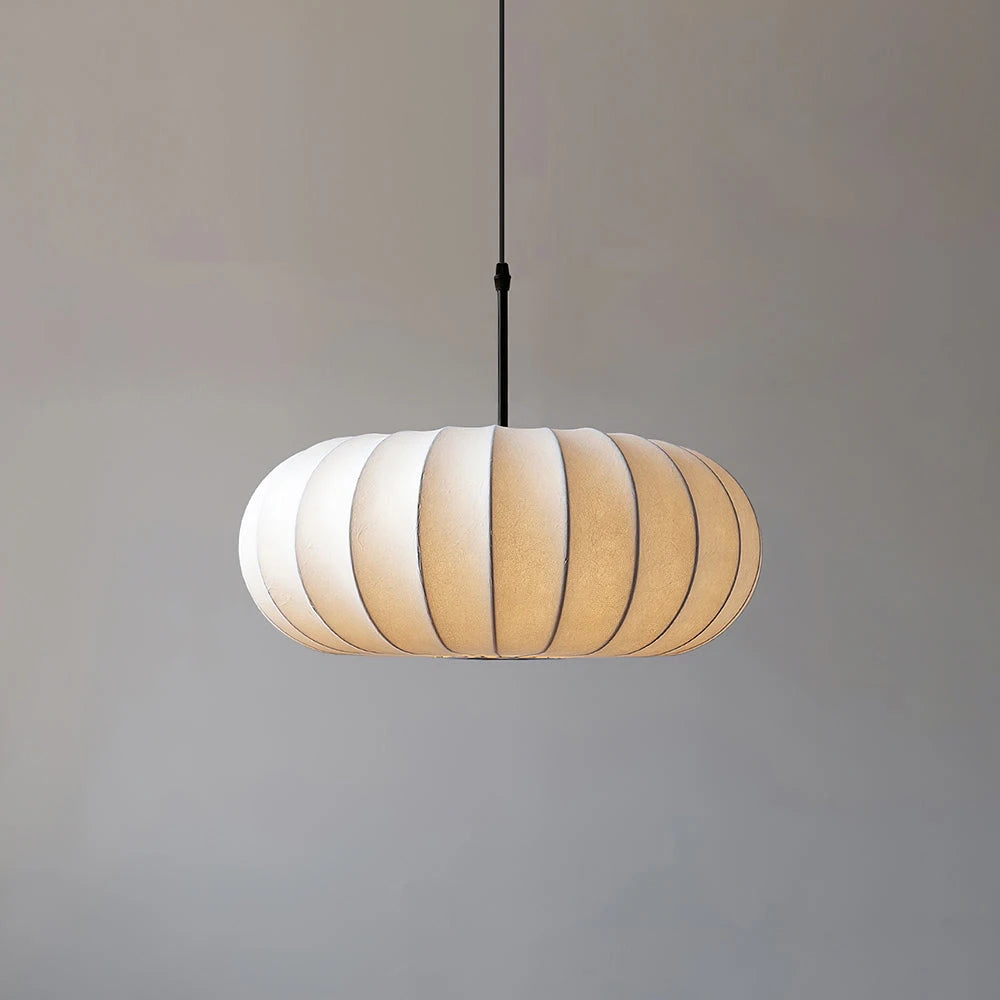 Verona Pendant Lamp Glowing Warm Light against Grey Wall