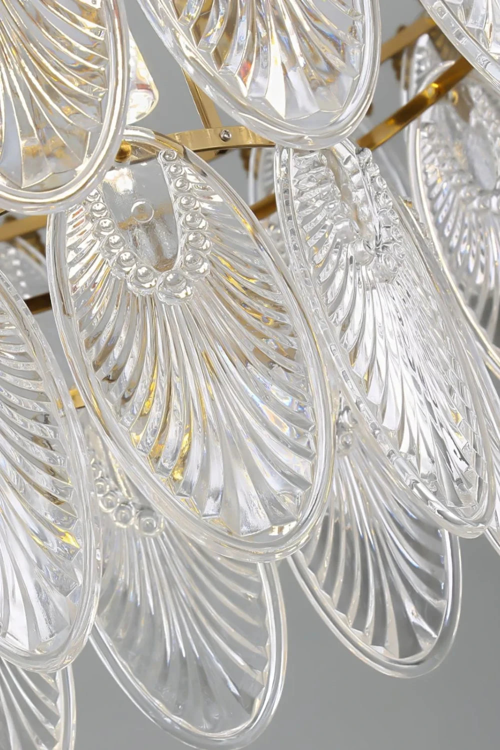 Close Up View of Clear Feather Wave Art Glass Texture and Antique Brass Details