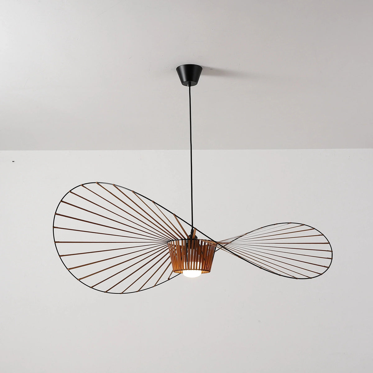 Side View of Modern Wood Base Black Wire Pendant Light Studio Shot