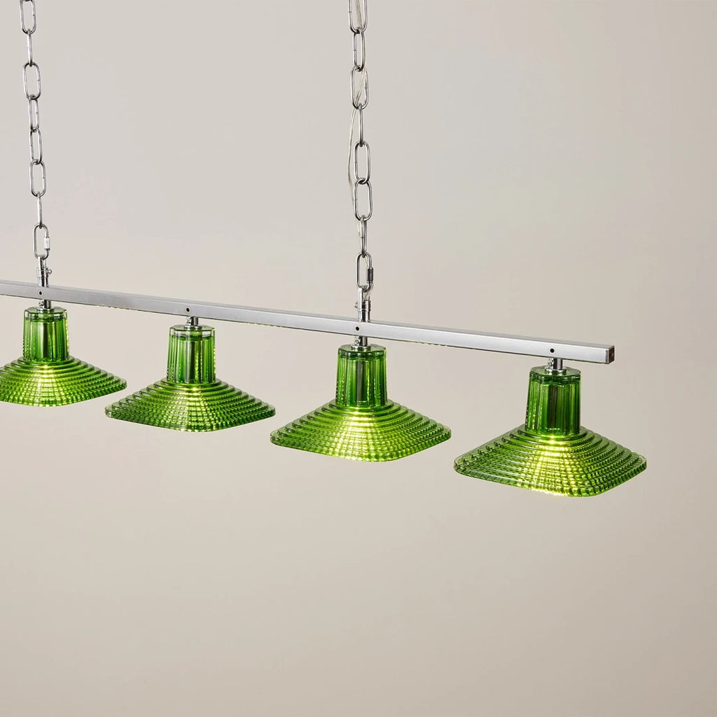 Close Up View of Illuminated Green Art Glass Shades and Linear Bar Details