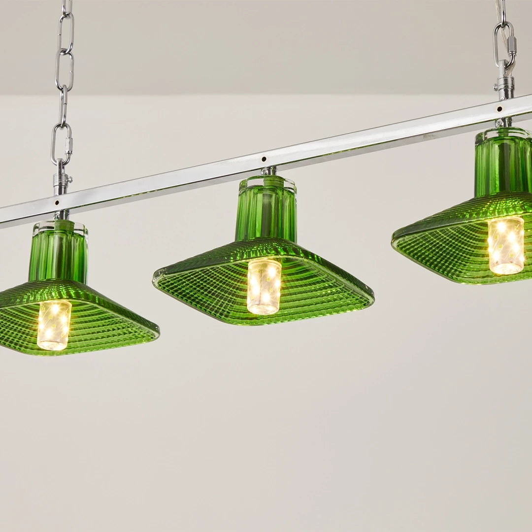Close Up View of Illuminated Green Art Glass Multi-Light Fixture on Pure White Background
