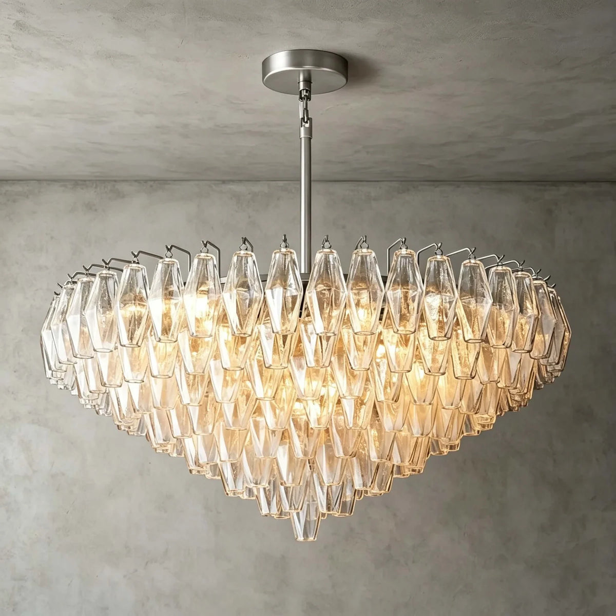 Angled View of Illuminated Modern Amber Faceted Art Glass Chandelier