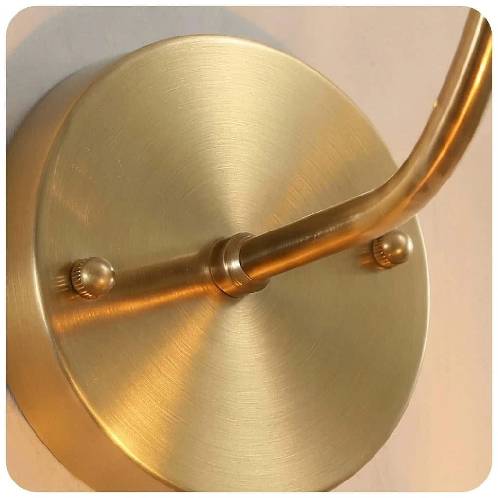 Close Up View of Brass Canopy Base and Curved Arm Hardware