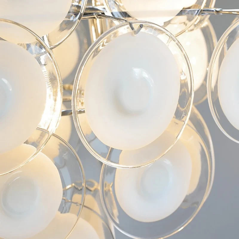 Close Up View of Round White Art Glass Discs and Chandelier Frame