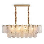 Modern Brass and Double-Tier Oval Wave Art Glass Linear Chandelier with Gold Canopy on Pure White Background