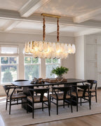 Modern Brass Double-Tier Oval Wave Chandelier in Open Plan Dining Setting