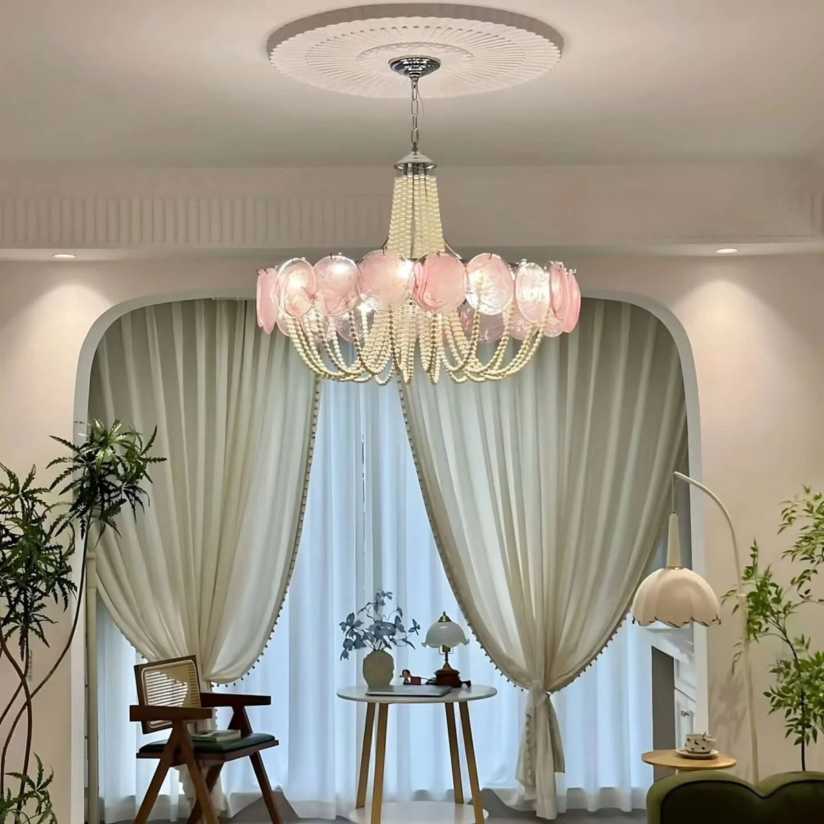 Front View of Pink Glass Disc Chandelier on Pure White Background