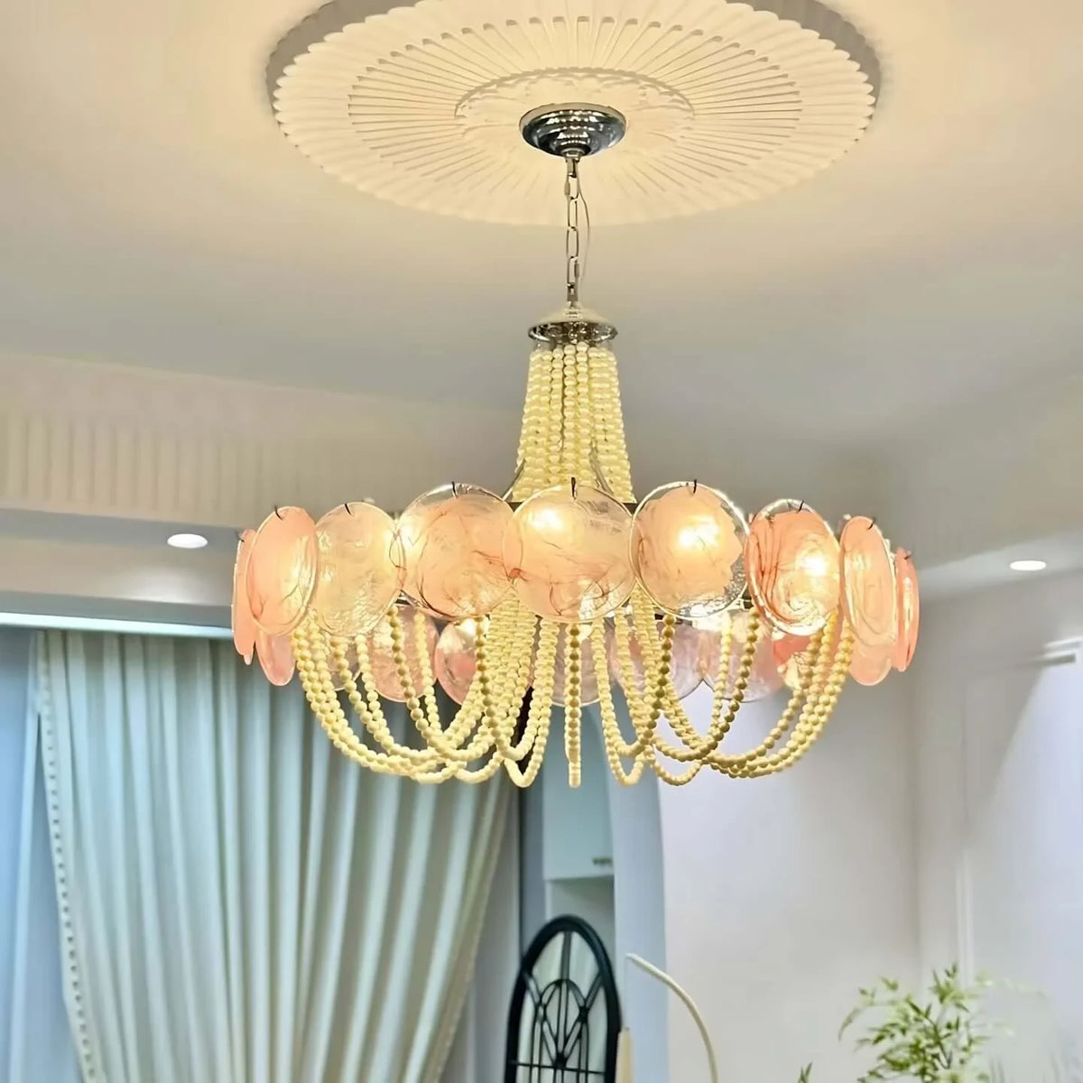 Low Angle Installation View of Pink Beaded Chandelier in Interior