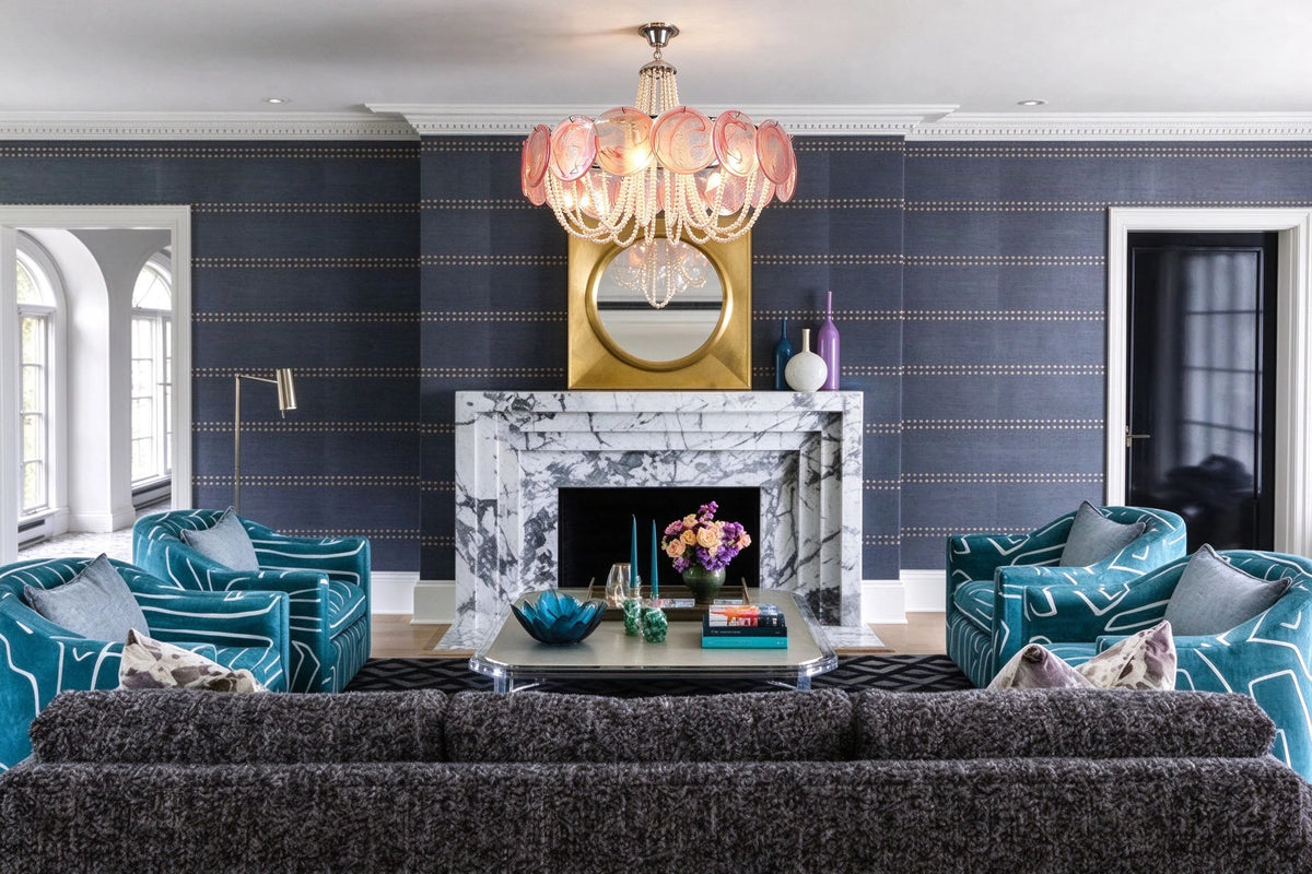 Dark Blue Toned Living Room Installation Shot of Pink Glass Chandelier