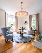 Bright Nordic Style Living Room Installation of Pink Glass Chandelier