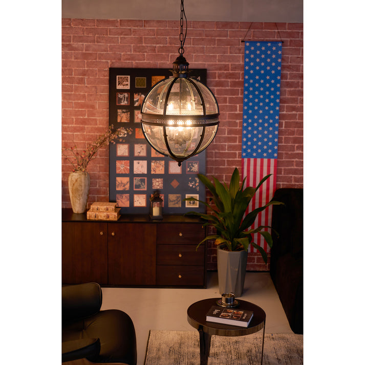 Industrial Brass Globe Pendant Lamp Over Console Table